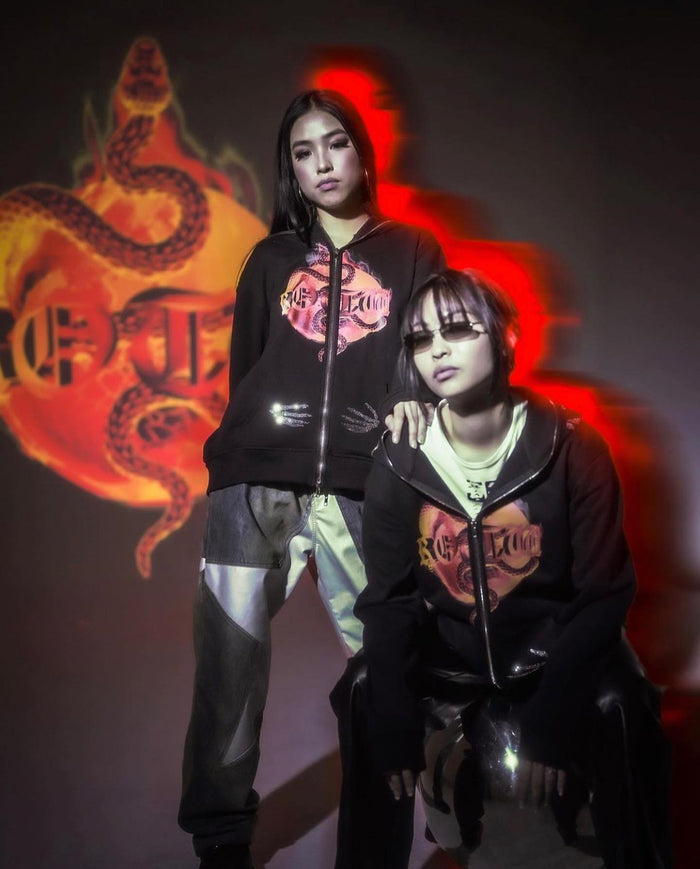 Two people wearing matching custom printed tees with a red dragon design
