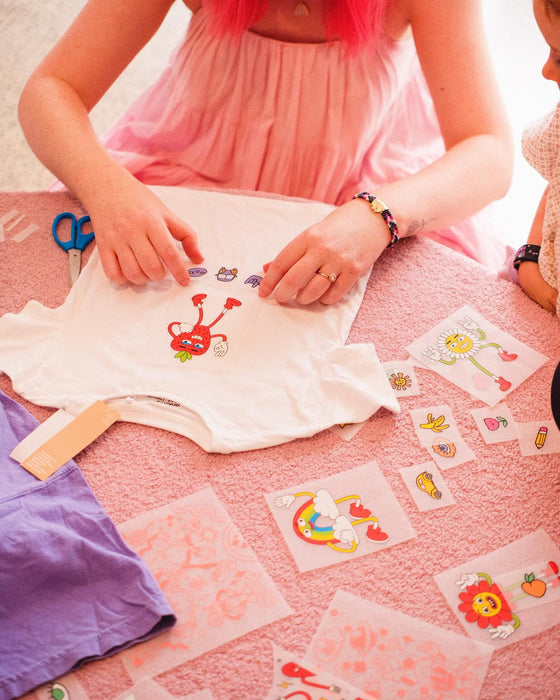 Pink custom printed tote bags laid out at an event