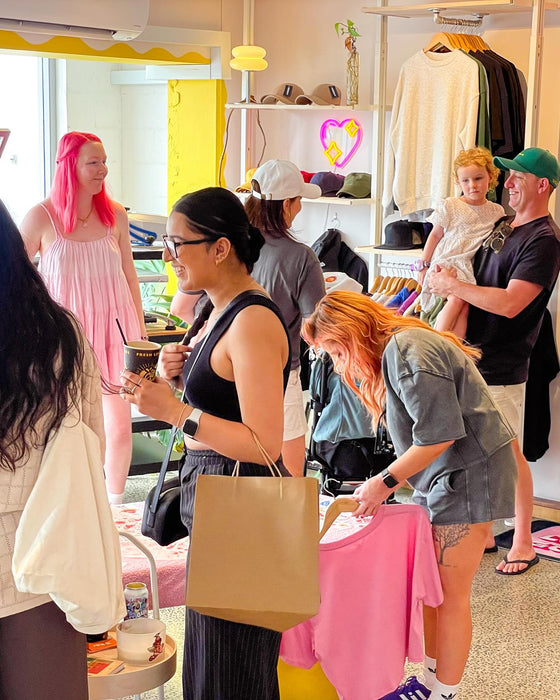Live event printing setup with people gathered around the stall